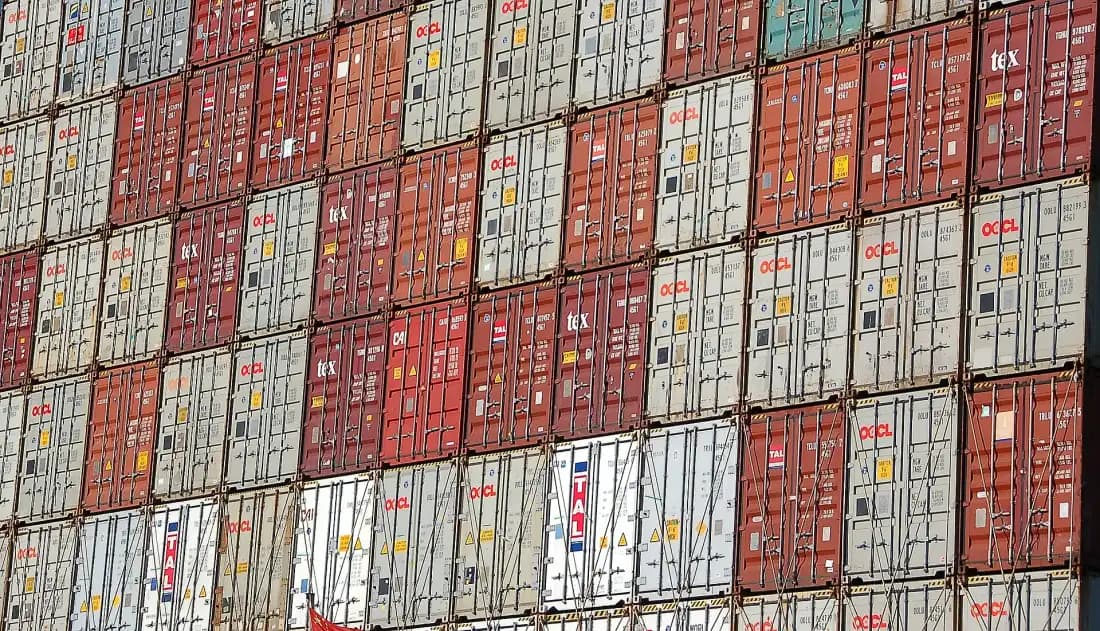 Shipping containers stacked high at a port
