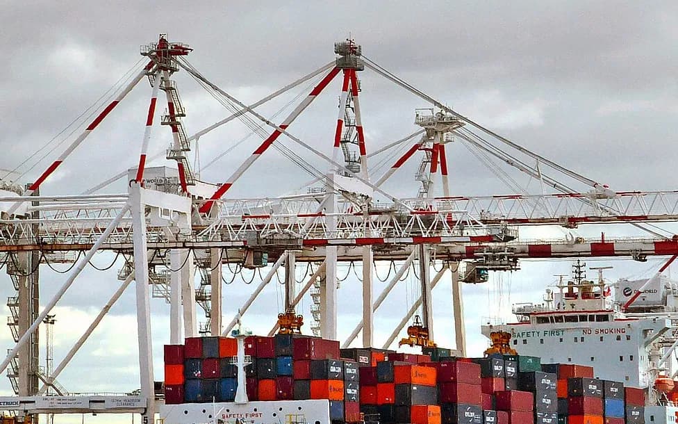 Gantry cranes over stacked containers at a Melbourne container terminal